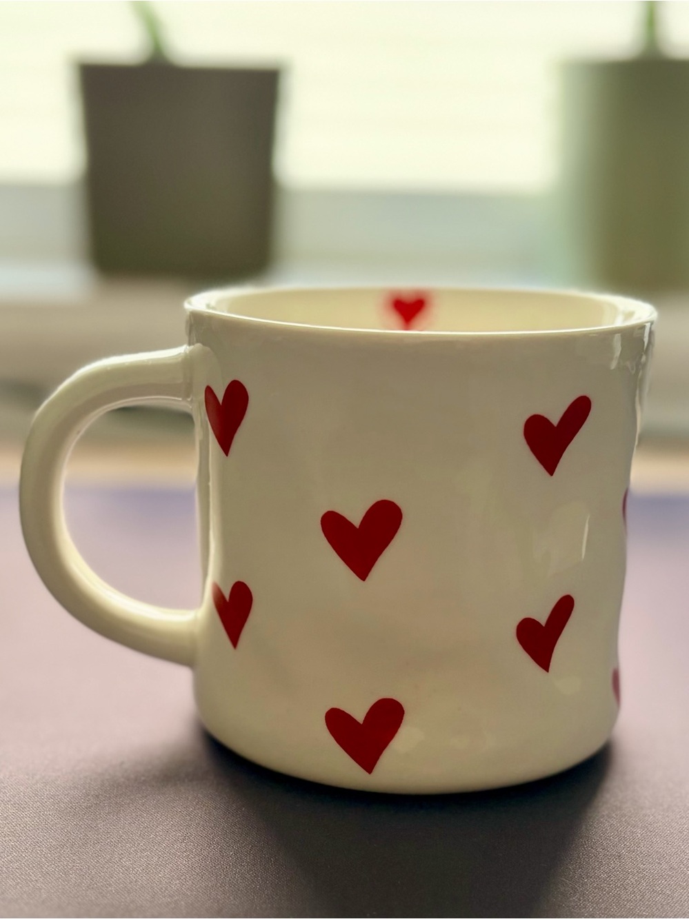 White Dimpled Ceramic Mug with Red Heart Pattern